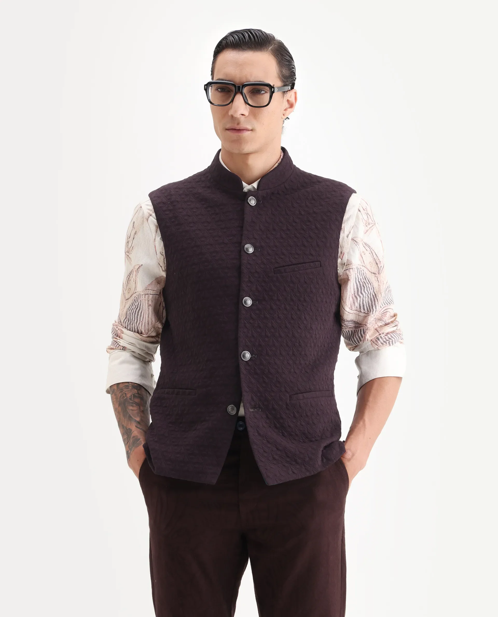 Rare Rabbit Men's Mitzi Dark Maroon Cotton Jacquard Tailored Fit Sleeveless Mandarin Collar Bandhgala Rare Rabbit Men's Lasmos-B1 Beige Viscose Embroidered Regular Fit Sleeveless Mandarin Collar Bandhgala Nehru Jacket