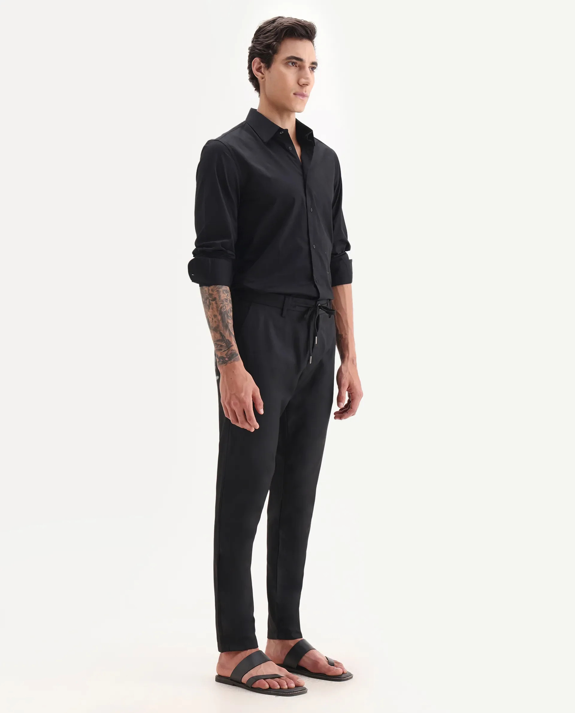 Rare Rabbit Men's Nimb Black Polyester Fabric Drawstring And Button Closure High Rise Regular Fit Solid Trousers - Image 6