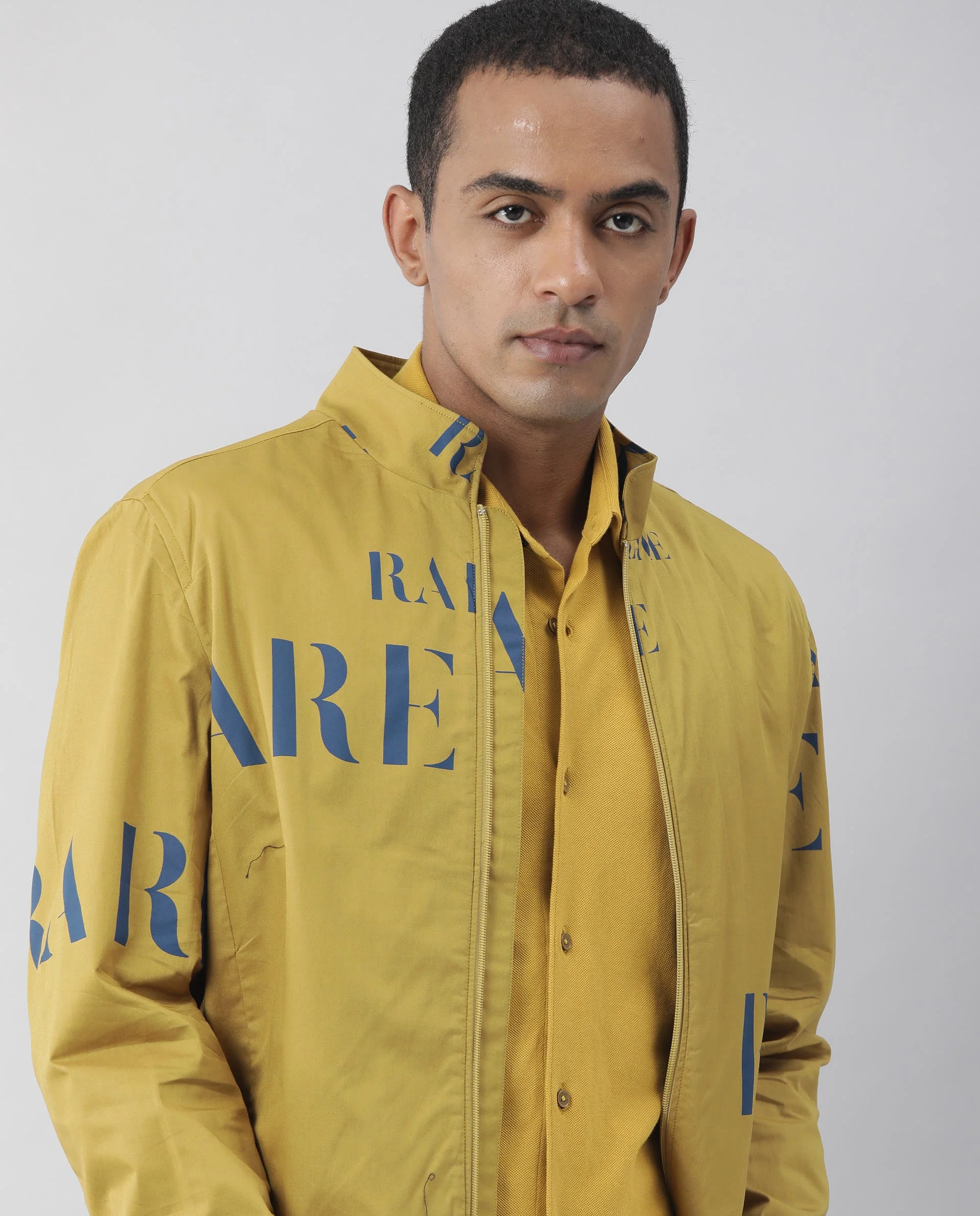 Rare Rabbit Men's Overed Mustard Polyester Monogram Print Regular Fit Full Sleeve High Neck Jacket - Image 4
