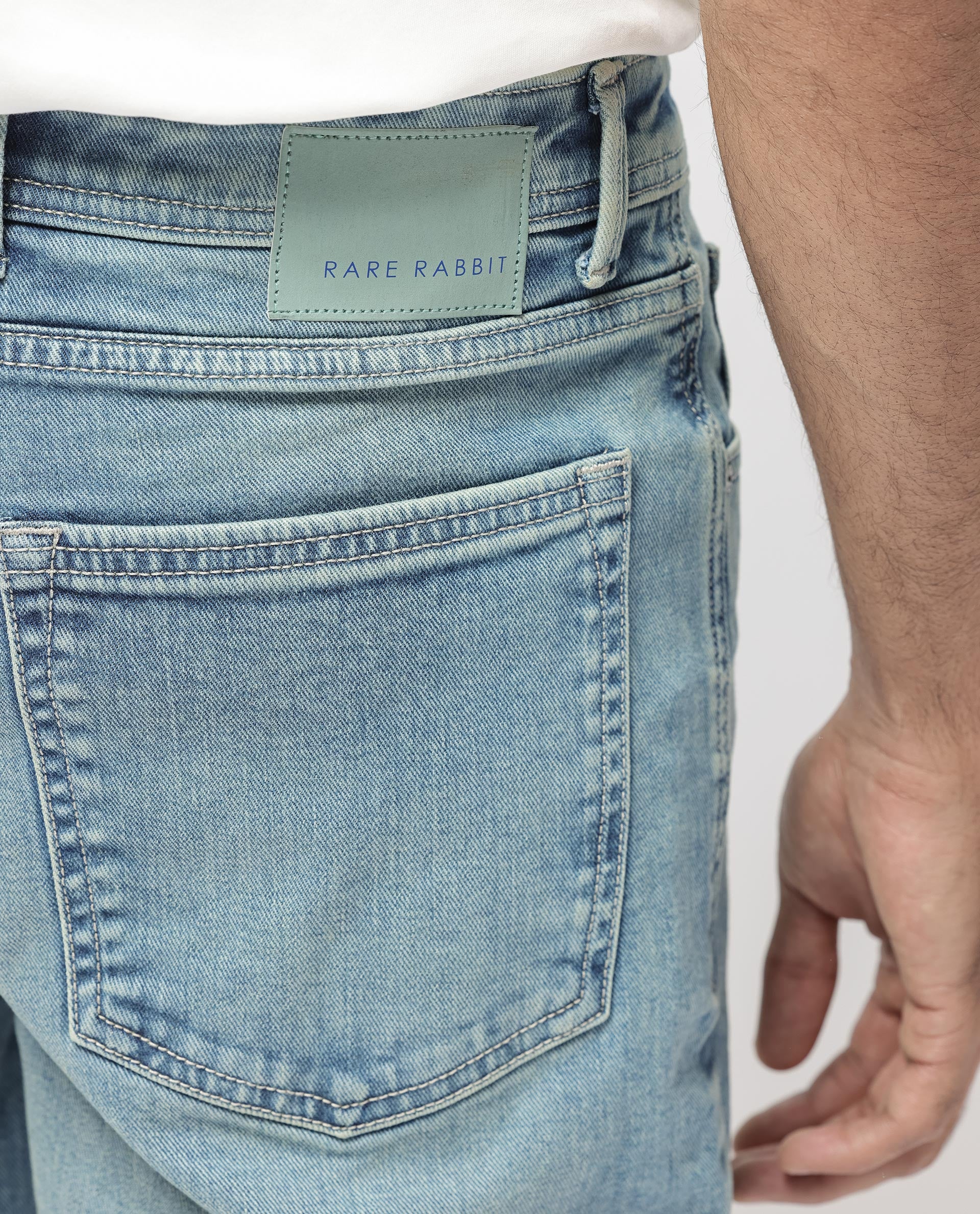Rare Rabbit Men's Sam Pastel Blue Cotton Plain Kurt Carrot Fit Jeans - Image 9